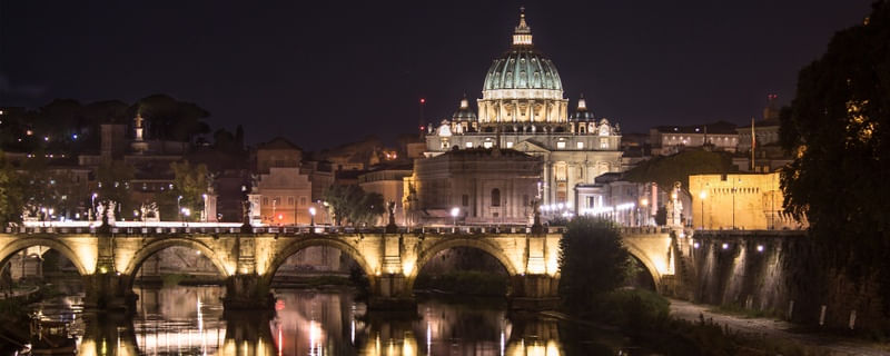 ST. PETER'S BASILICA AT NIGHT.