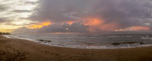 NASCER DO SOL COM NUVENS NA PRAIA DE CARAPEBUS