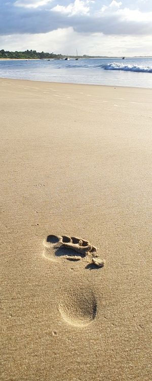 PÉ NA AREIA DA PRAIA