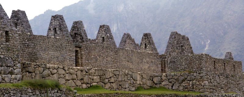 RUINAS DE CASAS NA CIDADELA DE MACHU PICCHU NO PERU CONSTRUÍDO EM PEDRA NO IMPÉRIO INCA