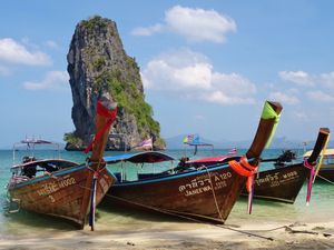 THREE LONG TAIL BOAT