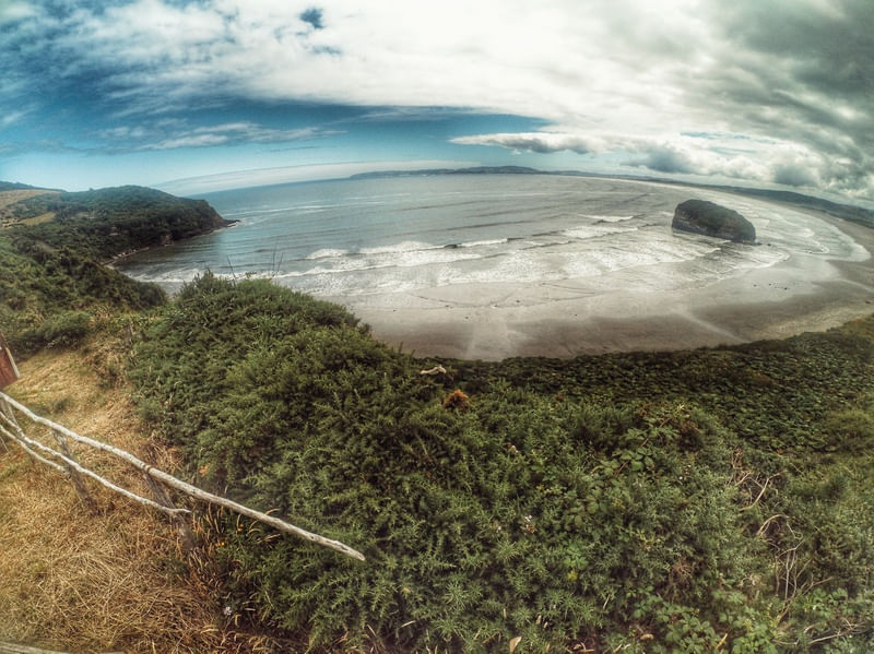 GREEN BEACH WITH CLOUDS