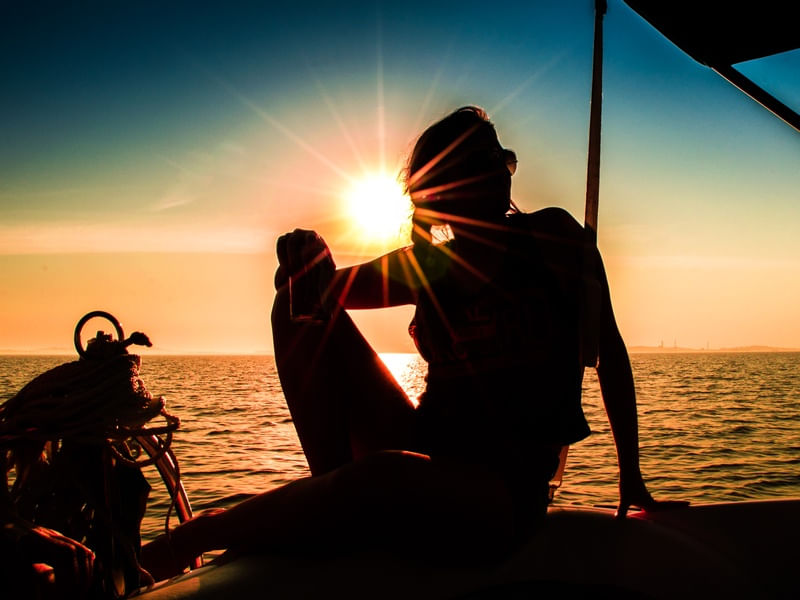 WOMAN ON THE BOAT SUNSET