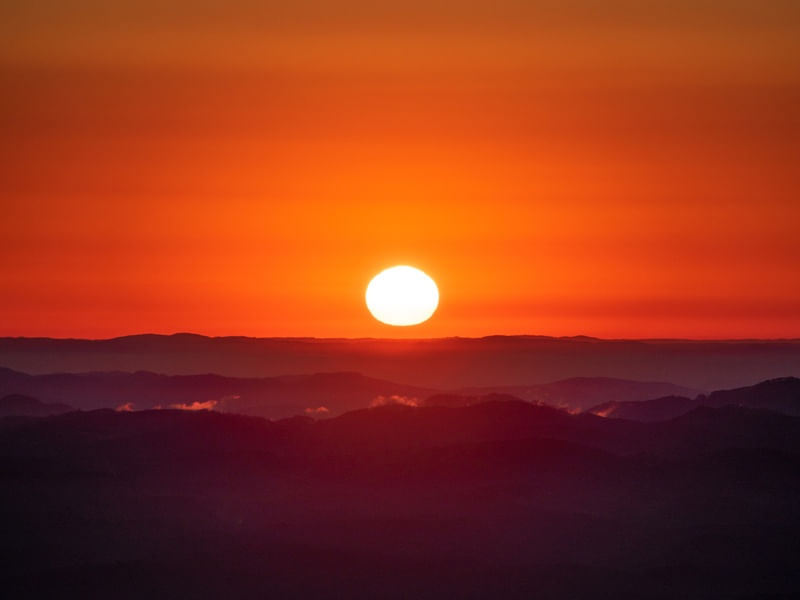 SUN AND MOUNTAINS