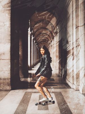 MONALISA RIDING ON HER LONGBOARD